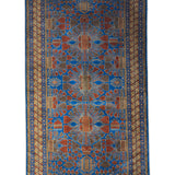 Noshirwan – Hand Knotted Wool Rug in Blue/Rust