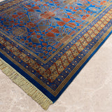 Noshirwan – Hand Knotted Wool Rug in Blue/Rust
