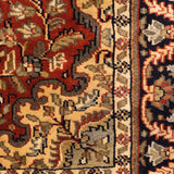 Rudshan – Hand Knotted Wool Rug in Rust/Navy Blue