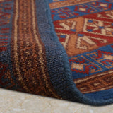 Noshirwan – Hand Knotted Wool Rug in Blue/Rust