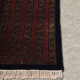 Zarrukh – Hand Knotted Wool Rug in Black/Rust