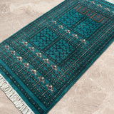 Zarrinab – Hand Knotted Wool Rug in Turquoise Blue/Black