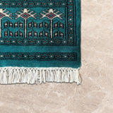 Zarrinab – Hand Knotted Wool Rug in Turquoise Blue/Black