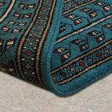 Kohistan – Hand Knotted Wool Rug in Turquoise Blue/Black