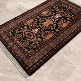 Ravand – Hand Knotted Wool Rug in Black/Russet