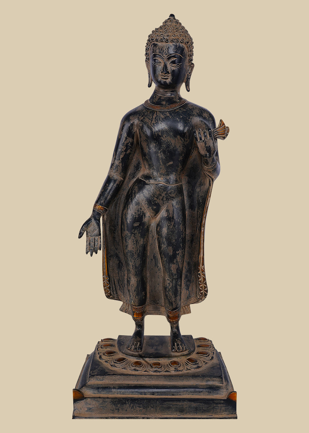 Brass statue of Lord Buddha standing with one hand raised in the Abhaya mudra (gesture of fearlessness and protection), wearing draped robes and standing on a carved lotus base.