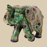 Intricately jeweled green elephant decor crafted from camel bone with detailed gold-tone metalwork and colorful semi-precious stone accents.