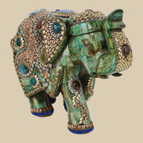 Ornate green camel bone elephant figurine featuring intricate gold-colored metalwork and various semi-precious stone embellishments.